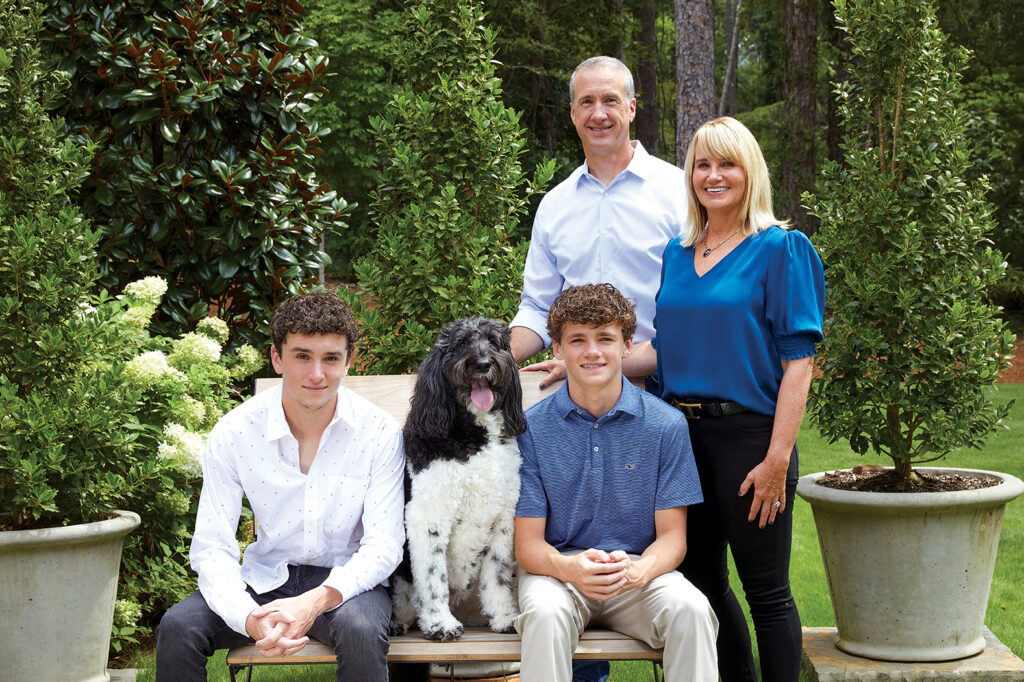 Jackson Family posing outside with family dog/