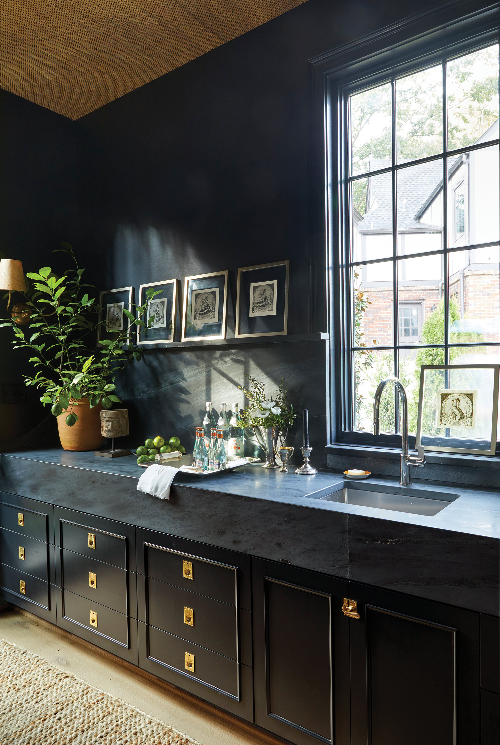 Mudroom walls and cabinets painted in Farrow & Ball color "Off-Black"