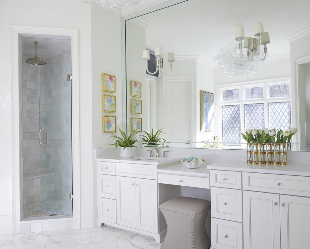 Bathroom vanity and adjacent shower.