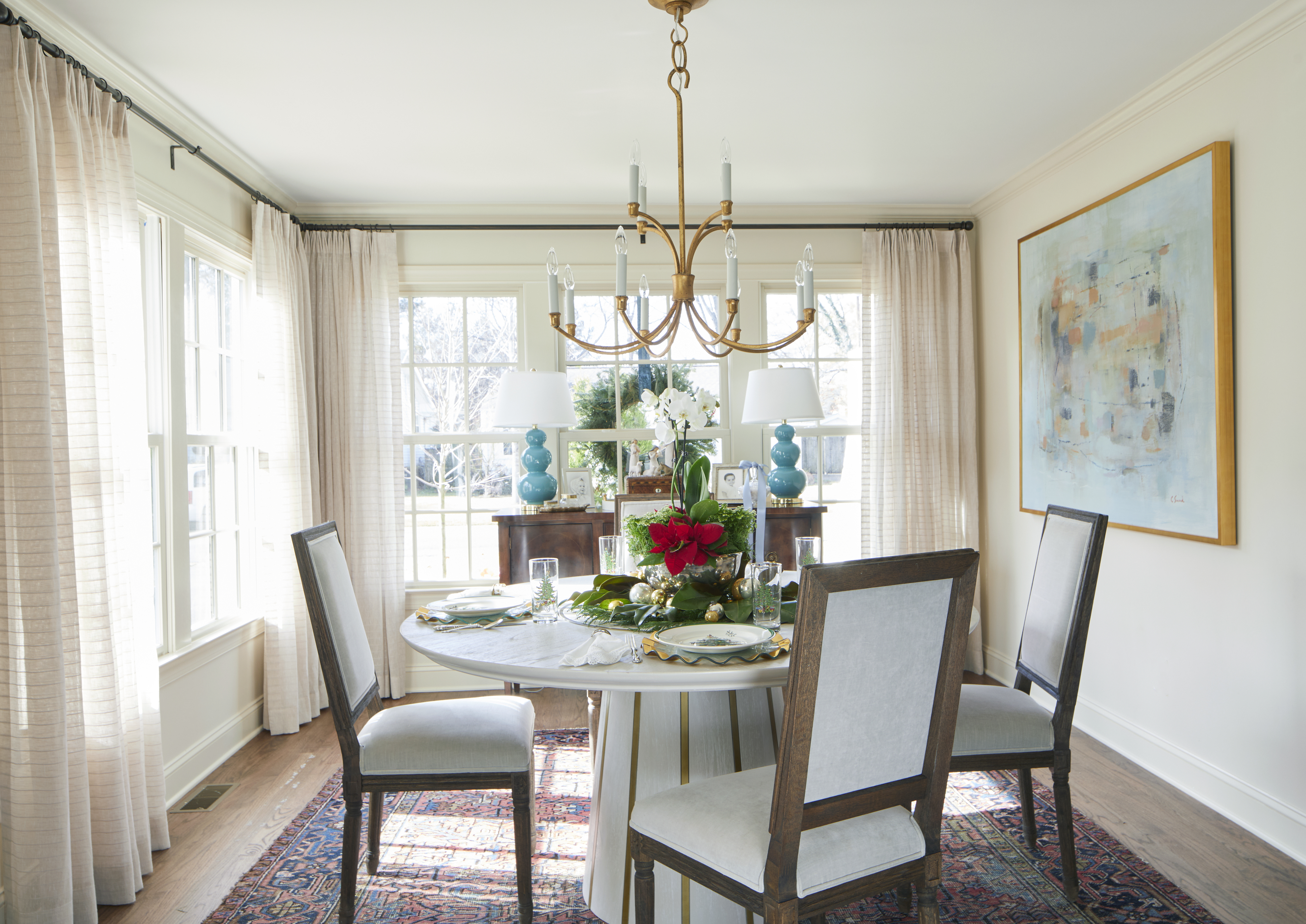 the Worleys’ dining room decorated for the season with a Christmas floral centerpiece and traditional Christmas china 